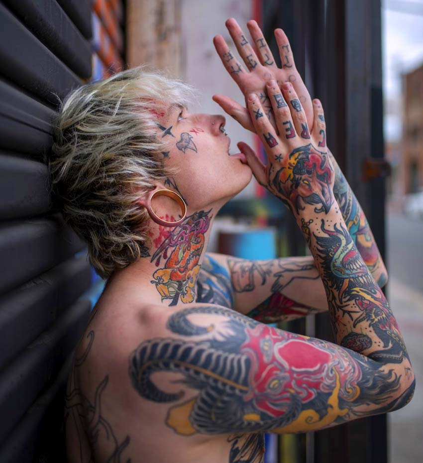 Man with Tattooed Arms and Neck Man with Tattooed Arms and Neck